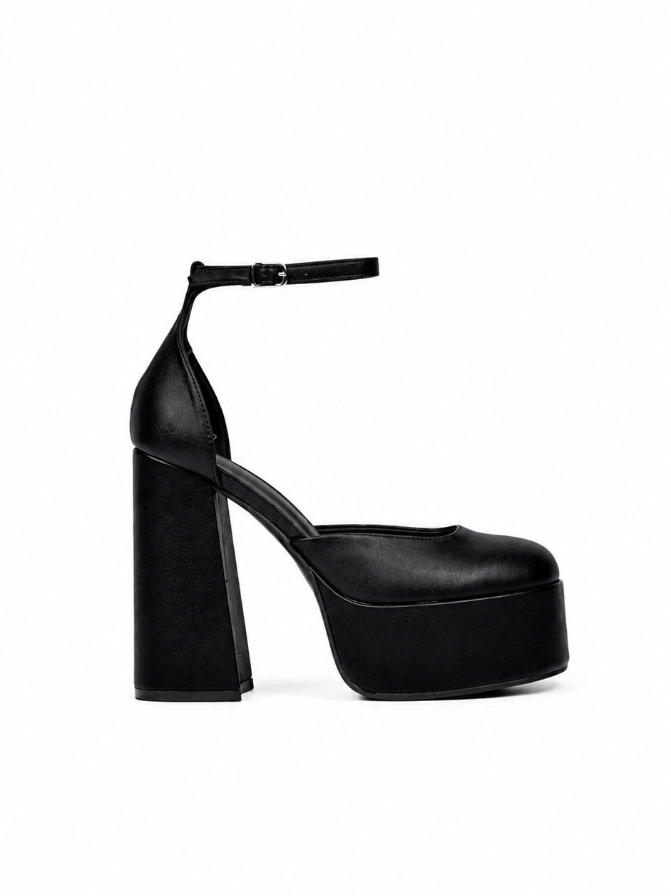 Black platform high heel shoe on a white background