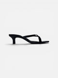 Black crock sandal on a white background