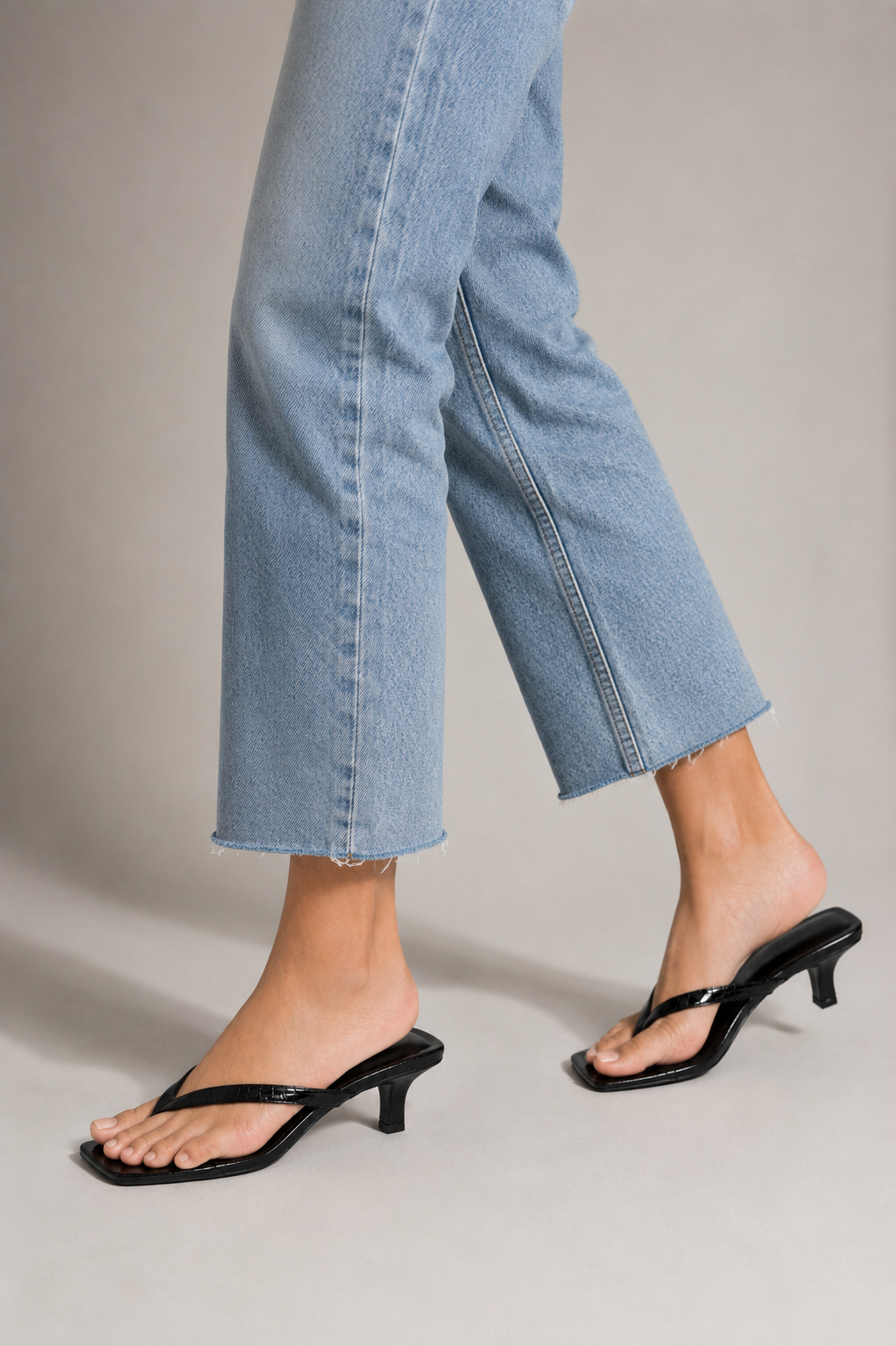 Black crock sandal on a white background