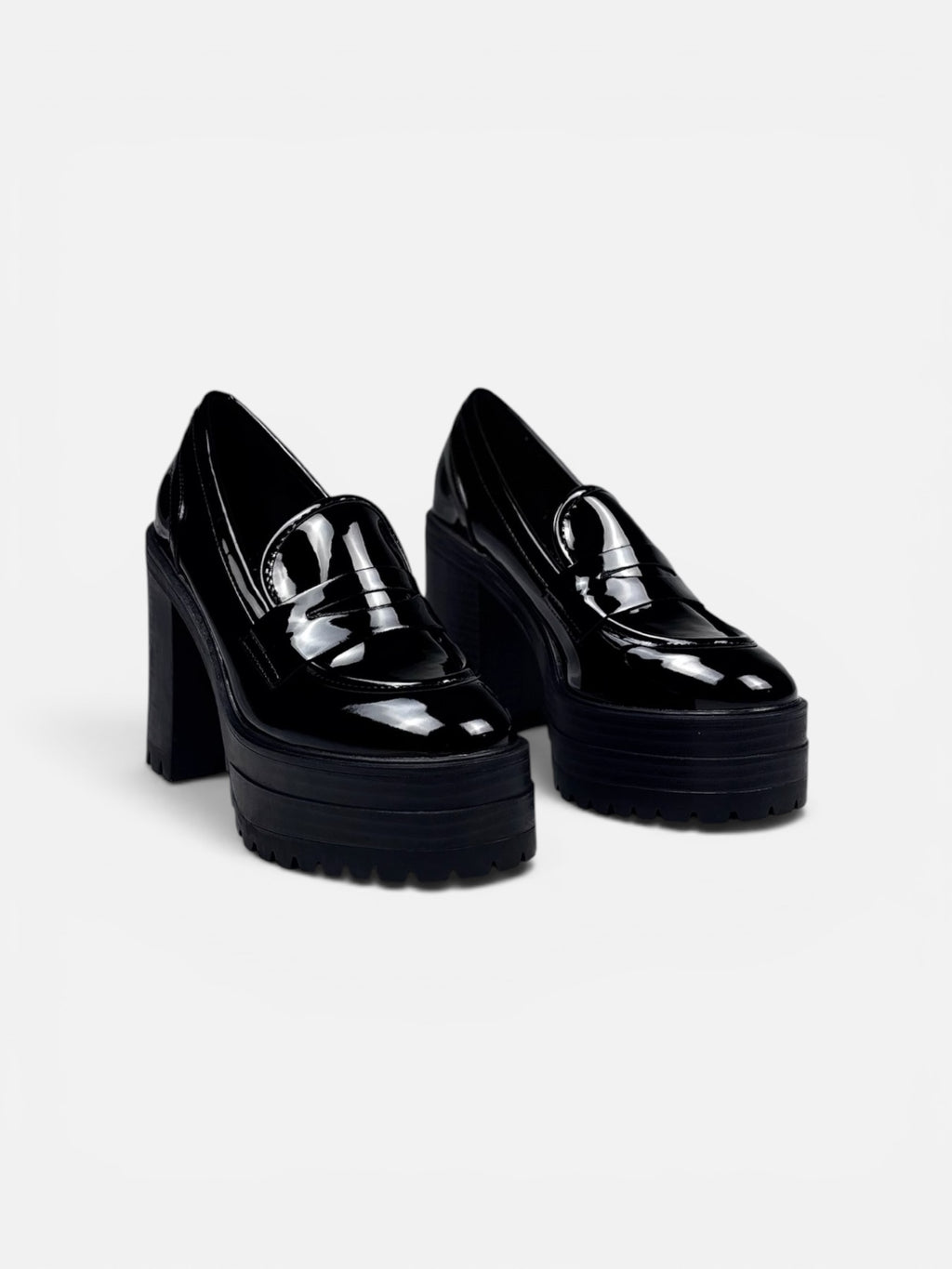 Black platform shoes on a light gray background