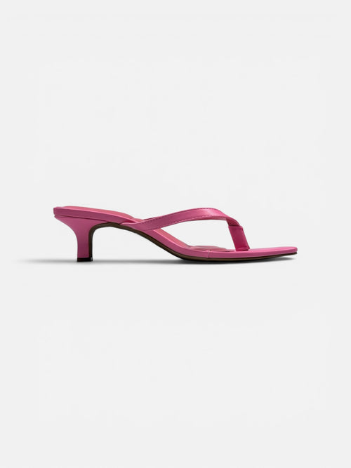 Pink sandal on a white background