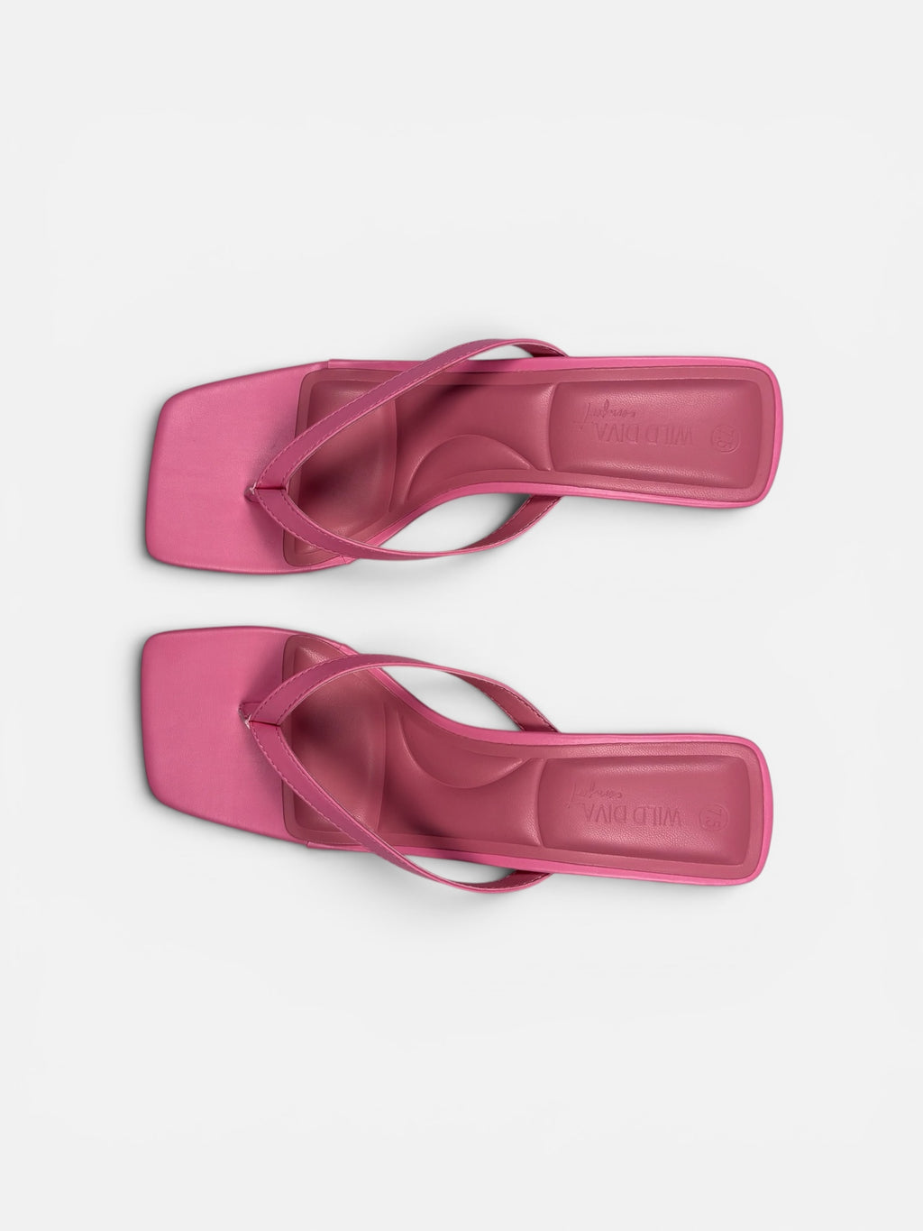 Pair of pink sandals on a light gray background