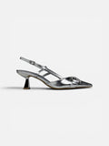 Silver high-heeled shoe on a white background